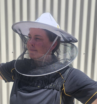Our Happy Bee model wears the Lyson cotton beekeeping hat with attached veil.