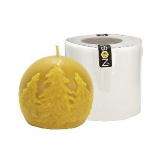 Beeswax candle shaped as a round ball with raised spruce tree detailing, displayed beside the white LYSON silicone candle mould used to create it.