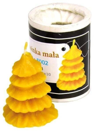 A silicone mould designed to create Christmas tree-shaped candles, with a few candles already shaped in the mould to show the final product.