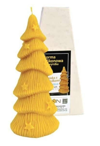 A silicone mould in the shape of a Christmas tree with stars, accompanied by its packaging.