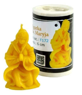 A silicone mould in the shape of St. Mary, with a yellowish tint, next to its packaging.